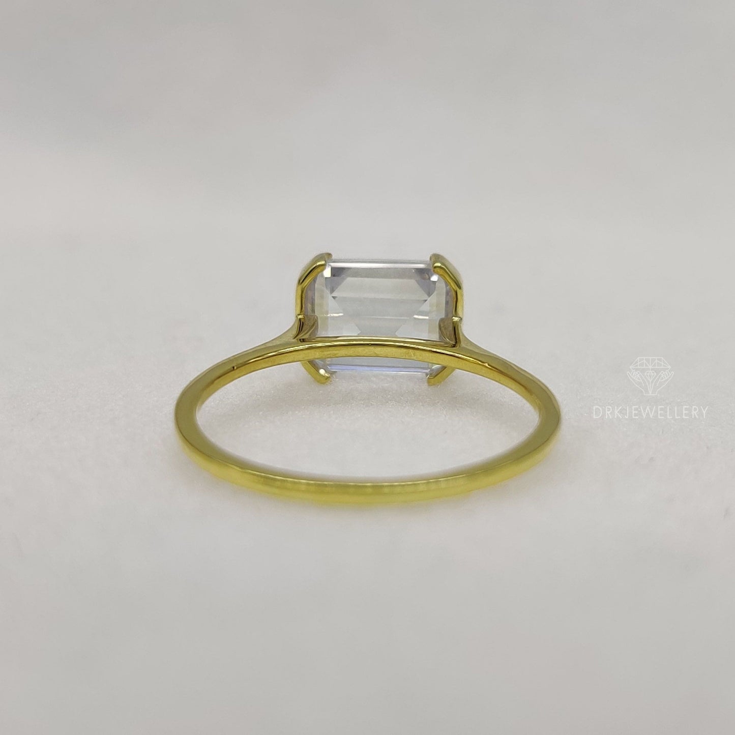 East West Emerald Cut Moissanite Half Bezel Set Gold RIng