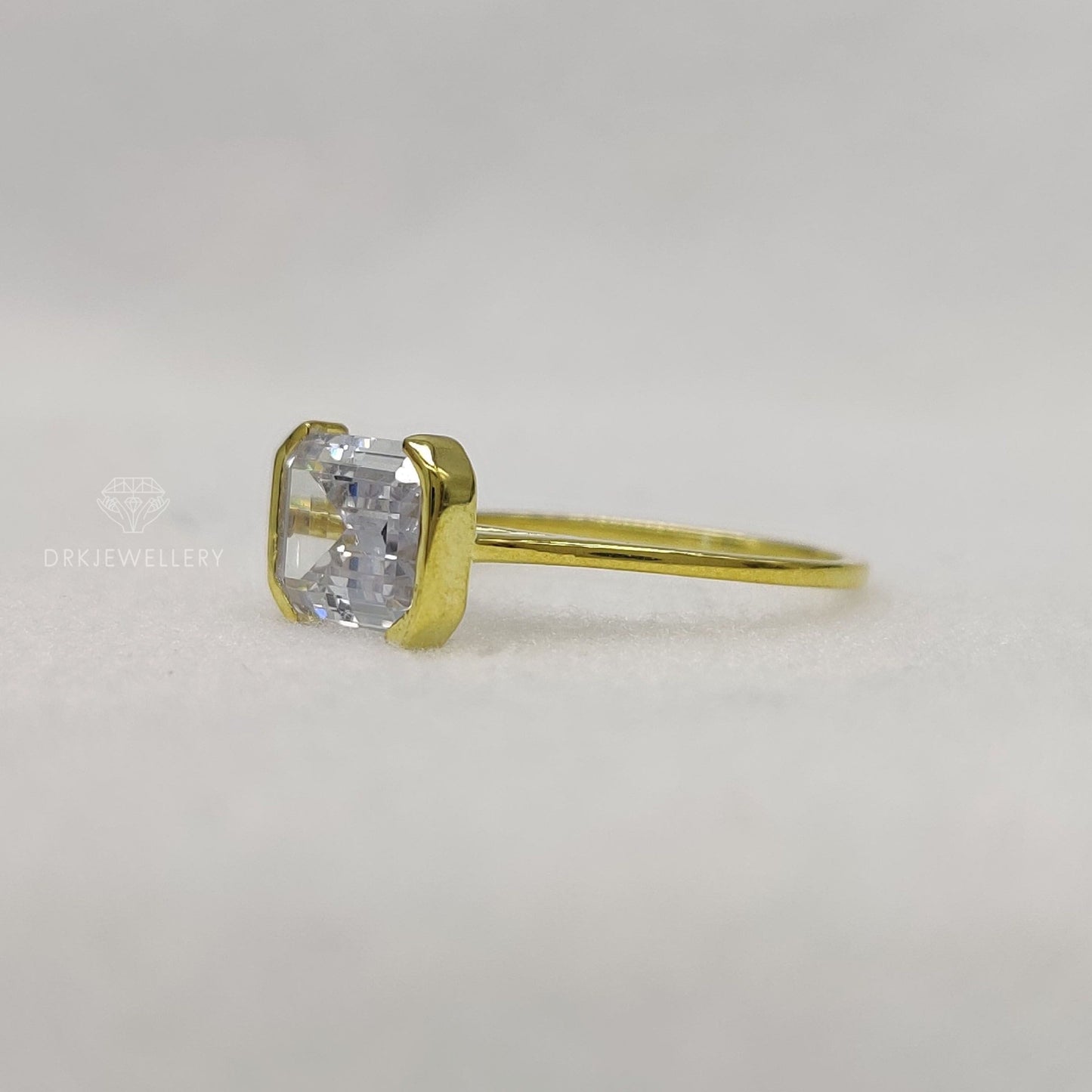 East West Emerald Cut Moissanite Half Bezel Set Gold RIng