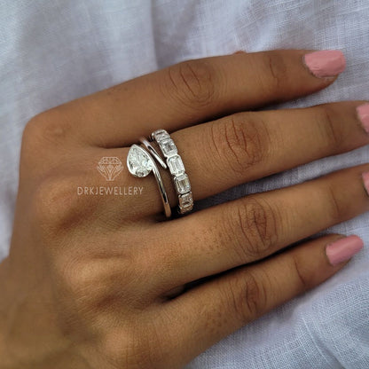 Bezel Set Pear Cut Lab Grown Diamond Ring With East West Emerald Band