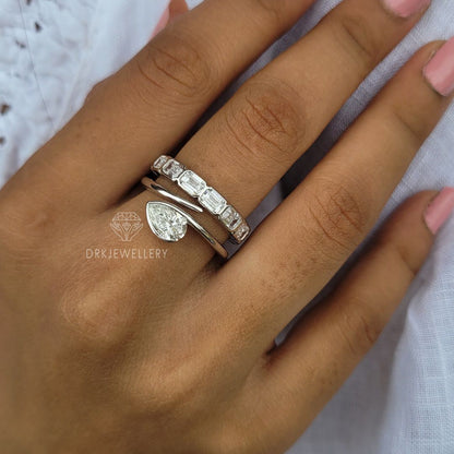 Bezel Set Pear Cut Lab Grown Diamond Ring With East West Emerald Band