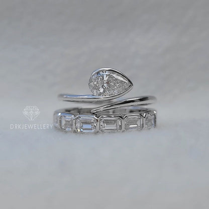 Bezel Set Pear Cut Lab Grown Diamond Ring With East West Emerald Band