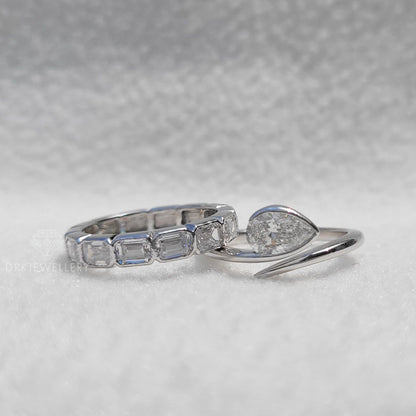 Bezel Set Pear Cut Lab Grown Diamond Ring With East West Emerald Band