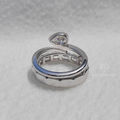 Bezel Set Pear Cut Lab Grown Diamond Ring With East West Emerald Band