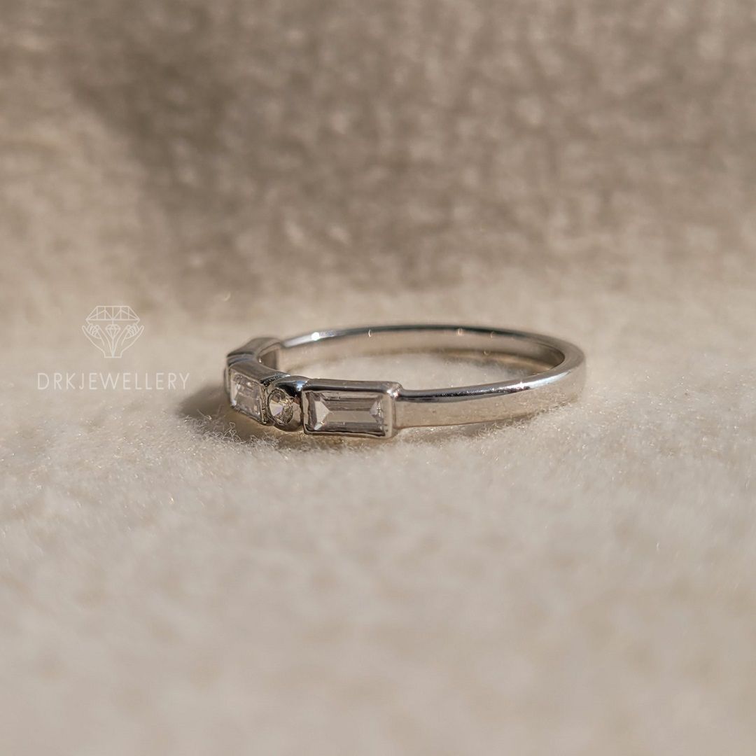 bezel set east west baguette cut lab grown diamond half eternity white gold ring