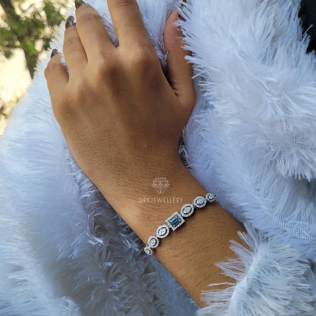 Emerald cut blue lab grown dimaond halo style bracelet for her as a gifts