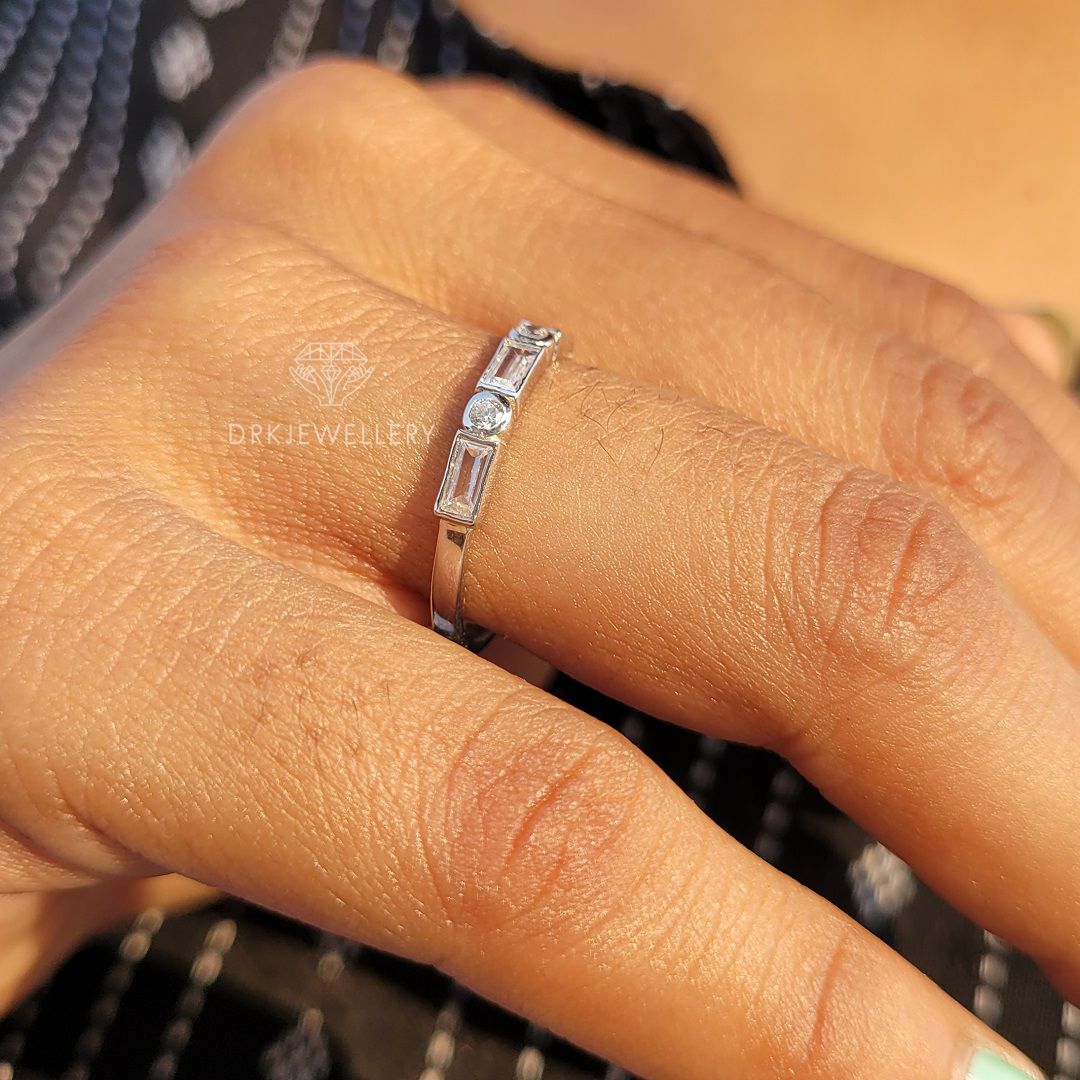 bezel set east west baguette cut lab grown diamond half eternity white gold ring