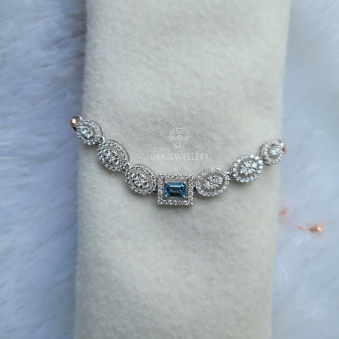Emerald cut blue lab grown dimaond halo style bracelet for her as a gifts