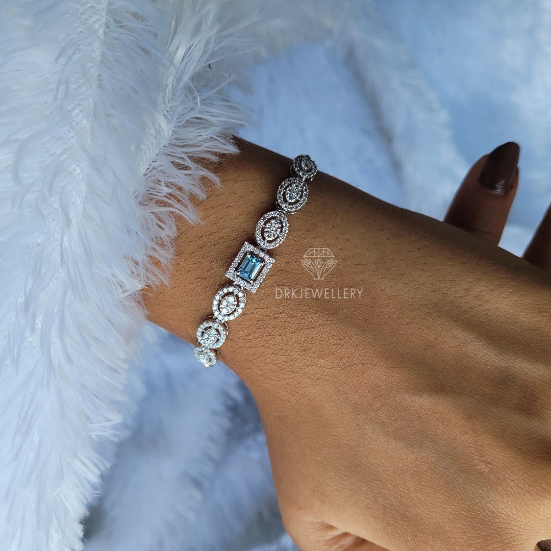 Emerald cut blue lab grown dimaond halo style bracelet for her as a gifts