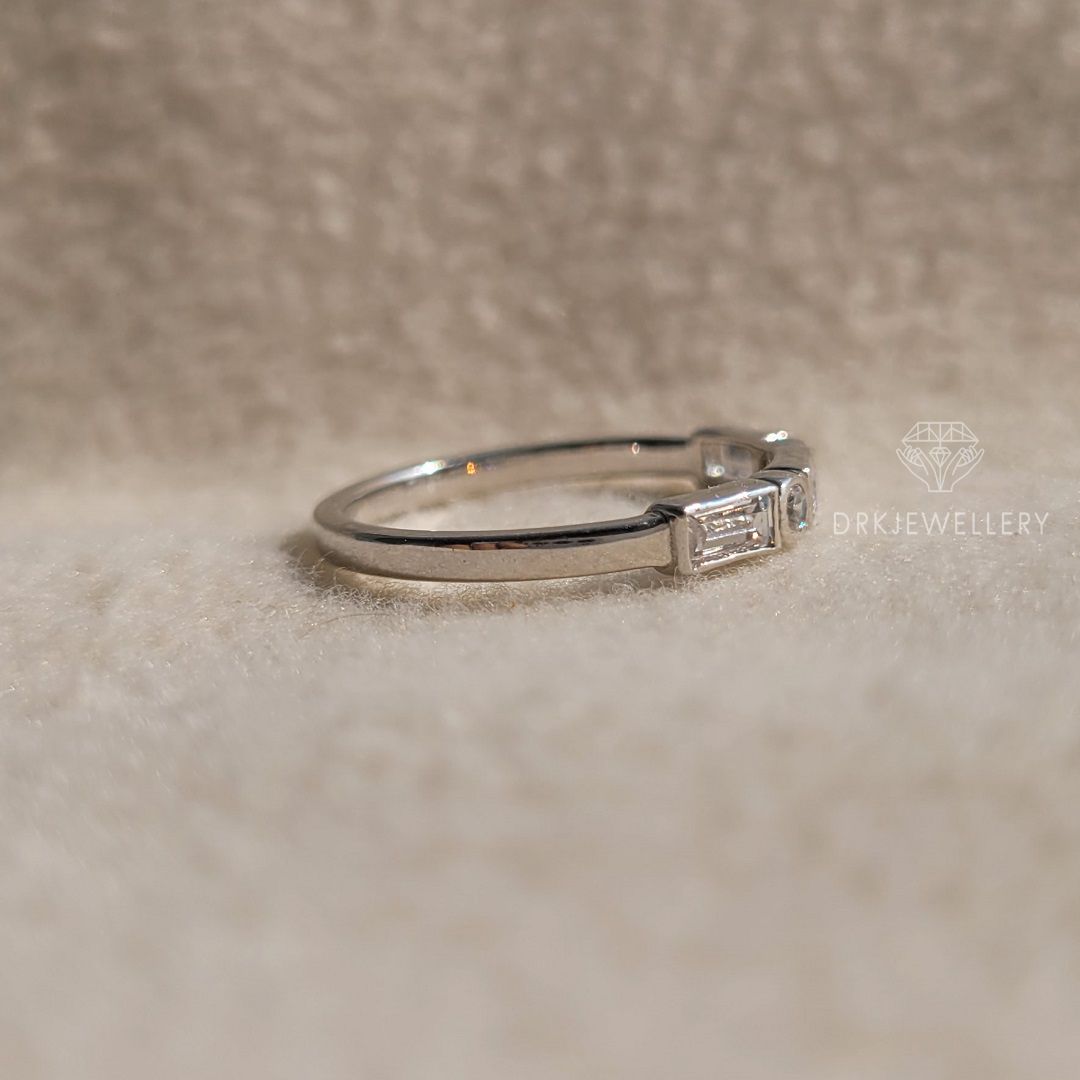 bezel set east west baguette cut lab grown diamond half eternity white gold ring